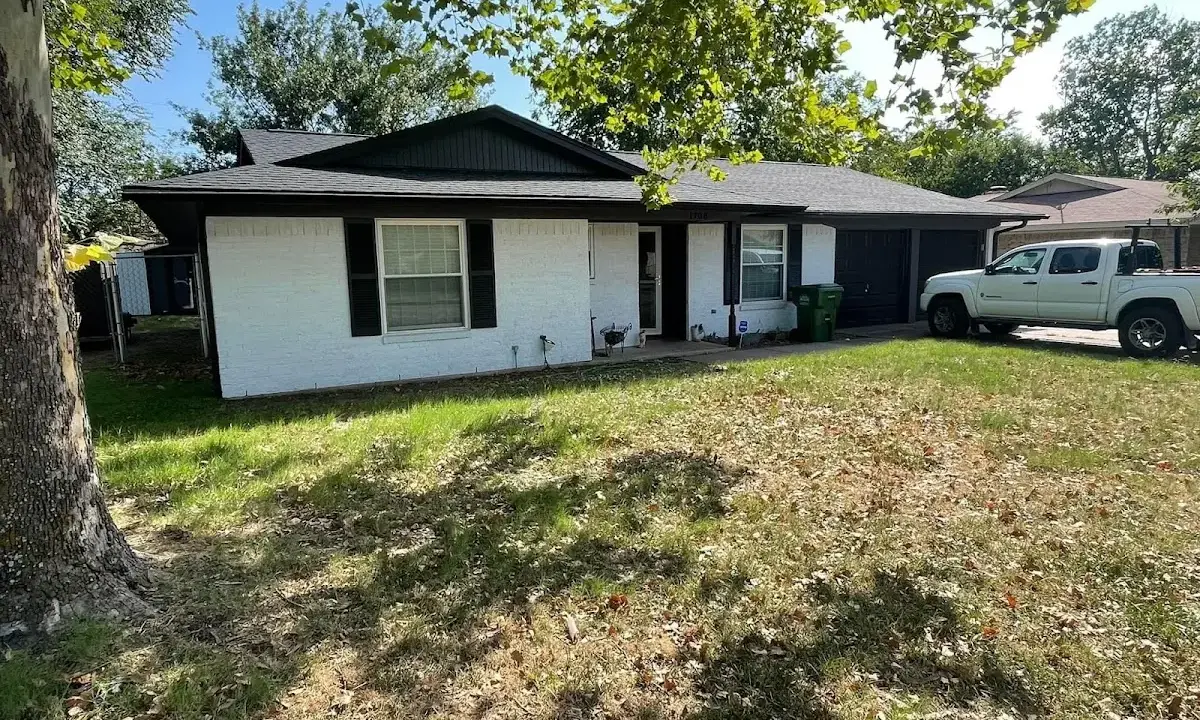 Professional roofing crew working on a residential roof in Amarillo
